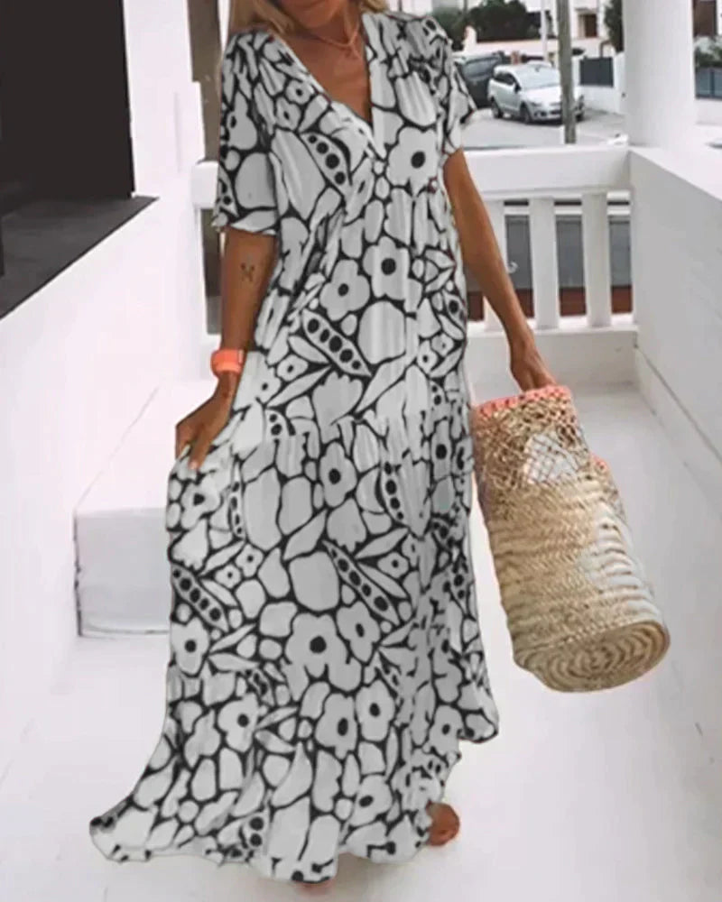 CHRISTINE™ | VESTIDO LARGO FLORAL CON ESCOTE EN V Y SILUETA LIGERA